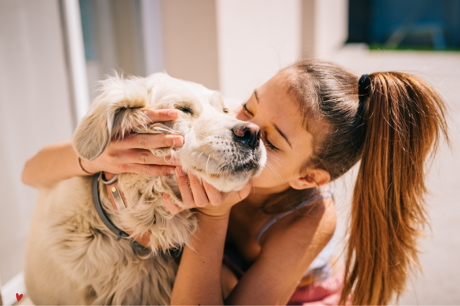 lady kissing her dog