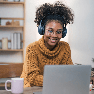 lady sitting at a desk on a laptop
